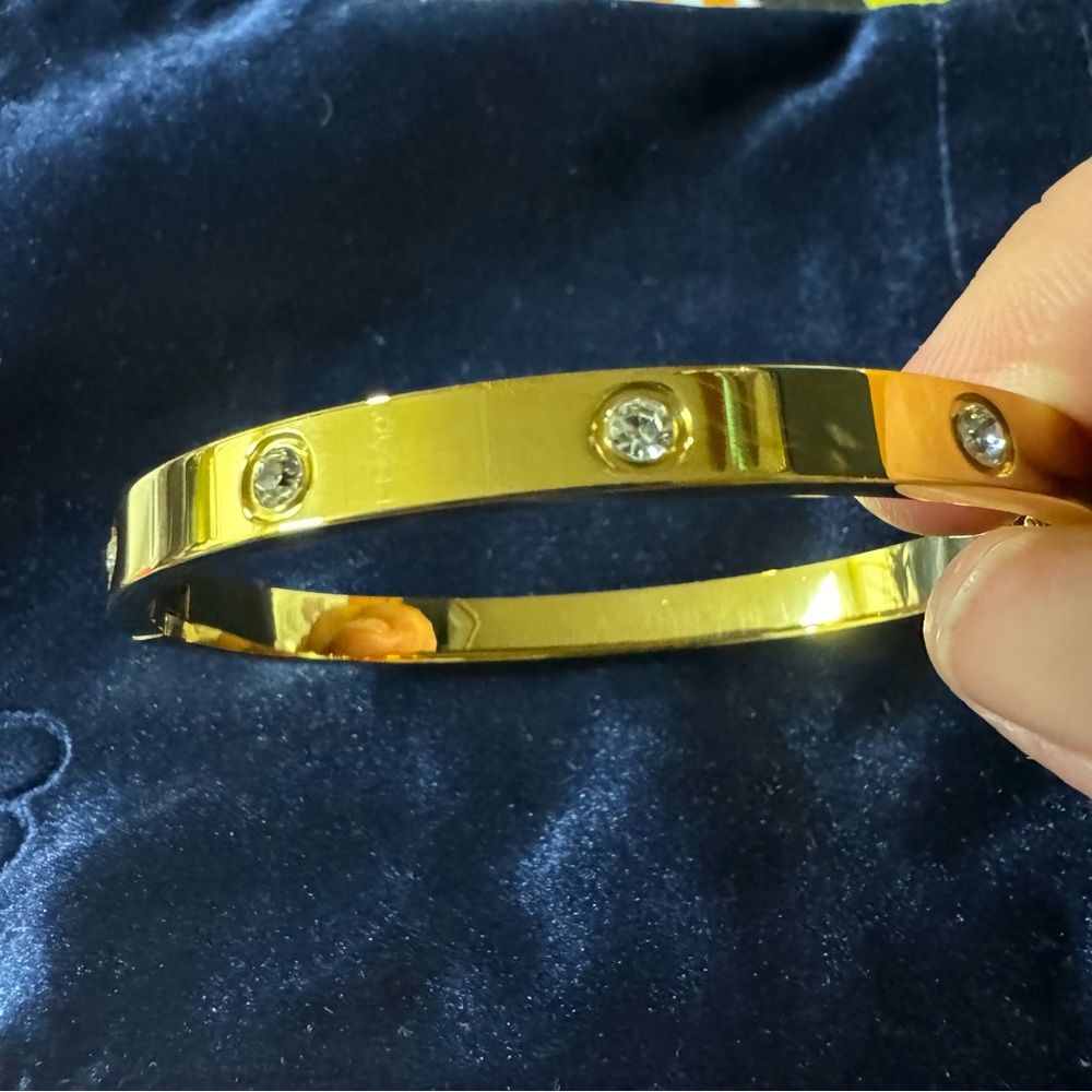 Designer inspired gold colored bangle